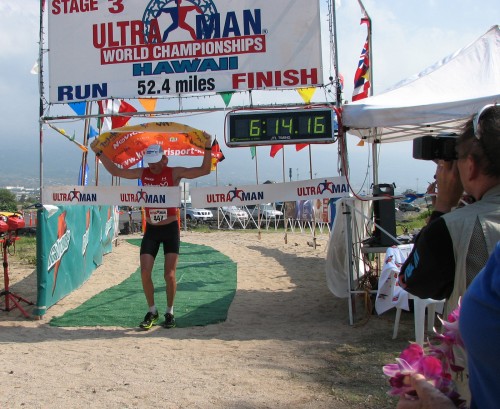 kregarfinish Miro Kergar flies the Slovenian flag as he crosses the finish line Sunday, Nov. 30, 2008 at Old Airport Beach Park in Kailua-Kona. His second place run time was good enough to earn him the Ultraman third place overall.