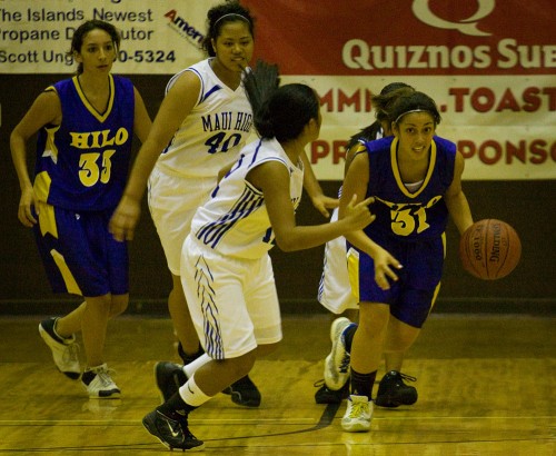 20081205_chelsea-cooper Hilo Viking Chelsea Cooper31) breaks away with Maui's Chynna Ramelb (12) moving in to get the ball back during second half action in Onizuka Gym at the Konawaena campus. (Photo by Baron Sekiya/Hawaii247.com)