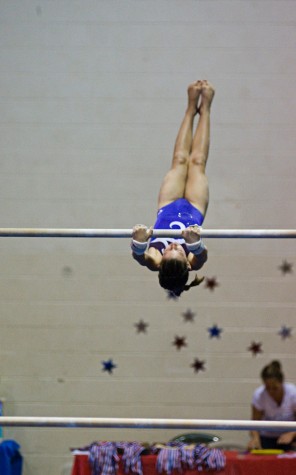 gymnastics hadley beach Hadley Beach, of the Kona Aerials, prepares to dismount from the uneven bars. (Photo by Susan Dabritz/SeaPics.com)