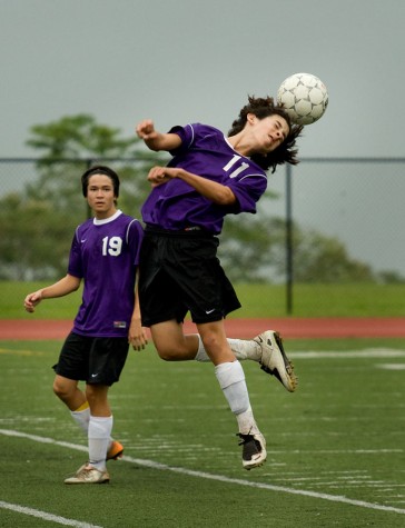 20090103_andrew-header Makua Lani's Andew Dong (11) goes up for a header with fellow Lion Michael Warnecke (19) by his side during BIIF soccer action against Kamehameha-Hawaii in Keaau Saturday afternoon. The game played to a 1-1 tie.