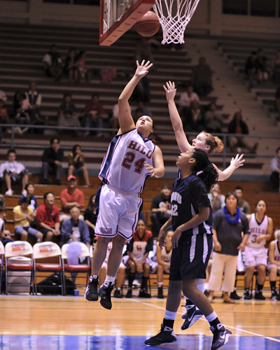20090110_uhh-nddnu0401 Hilo's Sheila Azevedo lays up the ball beyond the reach of NDNU's #23 Jennifer Dreessen and #32 Tanaia Keyes.