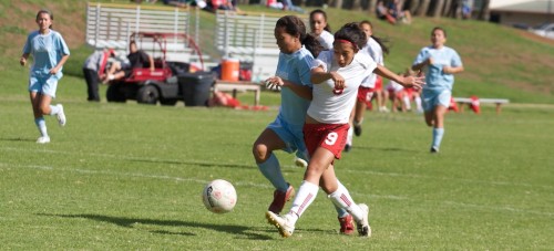 20090121_noe-enos HPA's Noe Enos (9) scores a goal in the second half of action against Kealakehe in Waimea. HPA girls won the game 3-1.
