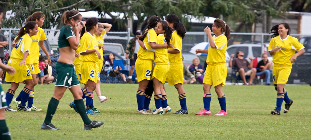 The Hilo Viking girls celebrate their 4-2 win as the regular season champions against the Konawaena Wildcats after their game in Hilo.