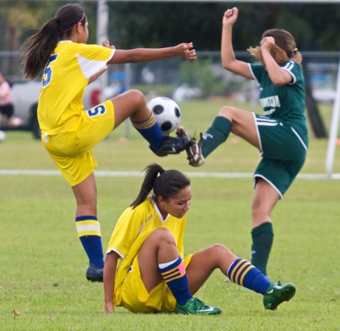 20090126_hiraishi-estencion Hilo's Billie Hiraishi (5), left, and Konawaena's Shanell Estencion (3) via for the ball during BIIF soccer action in Hilo.