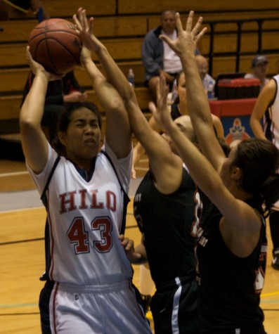 20090128_hotia-vaaimamao UH-Hilo's Hotia Vaaimamao (43) battles for the rebound against Academy of the Arts players during action in Hilo.