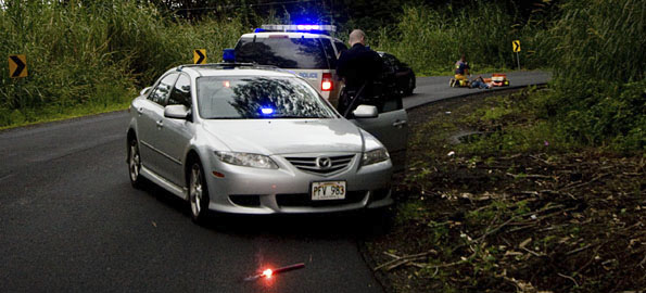 Police and fire/rescue personnel tend to to the victim of a single vehicle accident on Pohoiki Road. The accident involved a pick-up truck and closed the road for a short while for emergency crews.