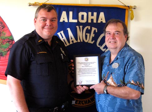 officer-joseph-passmore Aloha Exchange Club President Winston Churchill, right, presents an 'Officer of the Month' award to officer Joseph Passmore.