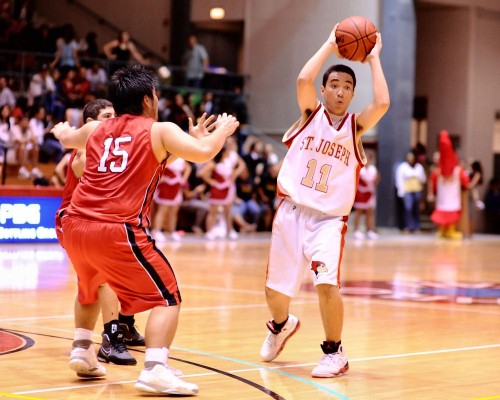 rnm-090130_0003 Will Scanlan-Leite of St. Joseph looks to pass the ball to a teammate as HPA's Kento Yokoi defends.