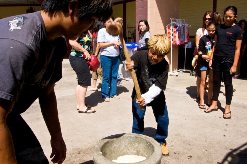 20090206_mochi-tsuki Kelsey Katayama, 11 years-old, works on pounding mochi rice during the mochi tsuki demonstration by Kona Hongwanji Mission.