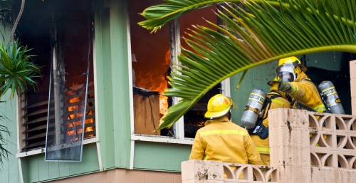 20090211_fire-hiluhilu-st2 The interior of the home is engulfed in flames preventing firefighters from entering the home from the front.
