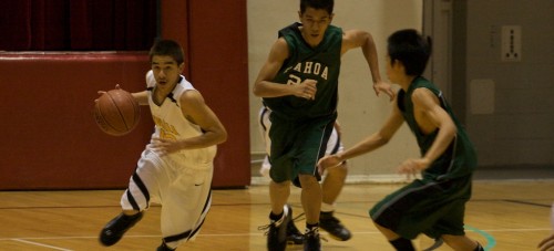 20090221_brandon-bautista Kohala Cowboy Brandon Bautista (12) gets the steal and heads downcourt with a pair of Pahoa Daggers in tow during BIIF Div-II championship action at Affook-Chinen Civic Auditorium. Kohala wins 59-43.