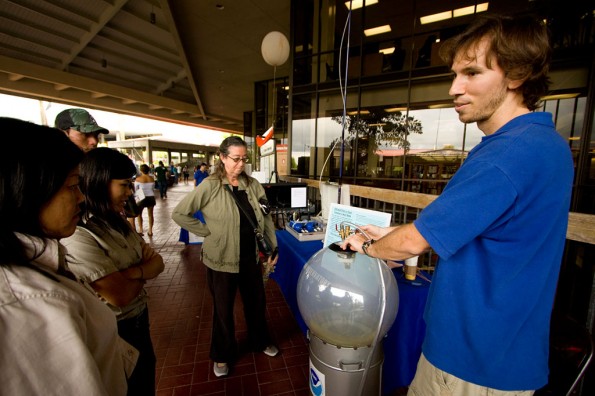 20090424_aidan-colton-mlo Mauna Loa Observatory scientist Aidan Colton, right, demonstrates how clouds are formed by making a cloudbank in an instant with a globe of water vapor during the Earth Fair by Hawaii Community College in Hilo.
