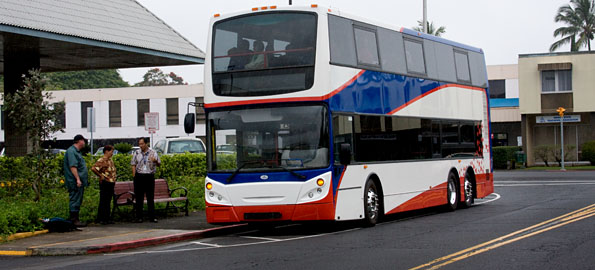 An Enviro 500 double-decker bus on Aupuni Street in Hilo is ready for a demonstration run for the media and county officials.