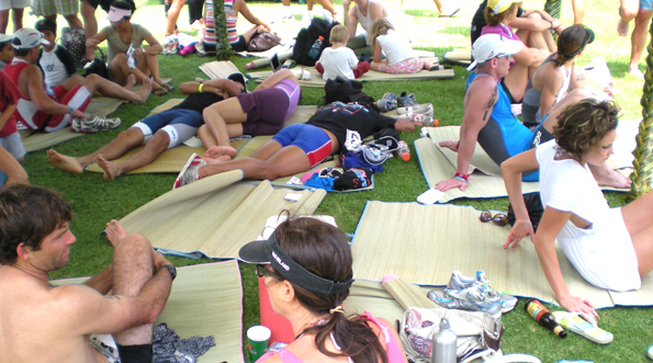 703aftermath Athletes take avdantage of the shade under a tent at the finish line. (Hawaii247.com photo by Karin Stanton)