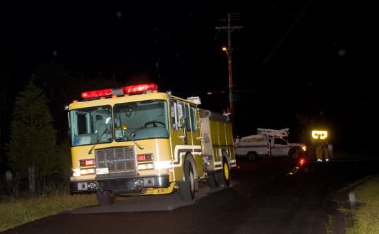 20090714_accident-firetruck Fire/Rescue crews responded to the accident. High power lines resting on trees ignited the treetops in small fires. Rain kept the fire under control as fire crews awaited power to shut down on the lines.