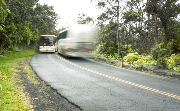 volcanoesparkbus Park roads today are overwhelmed by number and size of vehicles. A park shuttle system would help protect natural and cultural features along Crater Rim Drive such as this rock wall that stands as testament to the craftsmanship of the 1930s Civilian Conservation Corps. (Photo courtesy of Hawaii Volcanoes National Park)