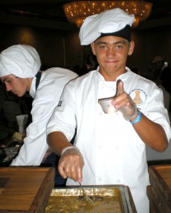 TasteHCC A Kona culinary student enjoys spooning up the beef chuckroll dish under the direction of Chef Paul Heerlein.