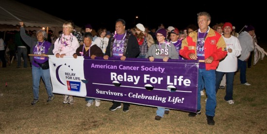 20091017_relay-for-life-waimea00401 Cancer survivors and caregivers take the first lap at the Relay for Life event at Waimea Park Saturday night (Oct 17). Participants will be doing laps around the field and along with a silent auction and sale of food will be raising funds for the American Cancer Society. Photography by Baron Sekiya for Hawaii 24/7.