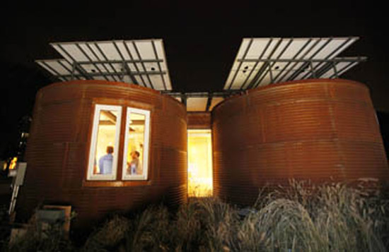 2009 Solar Decathlon Students from the Cornell Hotel School cook in their team's solar-powered house for students from Virginia Tech, Team Germany, and Team Boston during the U.S. Department of Energy Solar Decathlon 2009 on the National Mall in Washington, D.C., Friday, Oct. 9. (Photo courtesy of Stefano Paltera/U.S. Department of Energy Solar Decathlon)