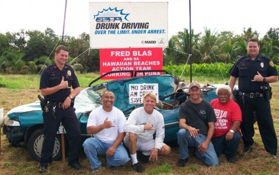 dui-sign-waving Community police officers and members of the Hawaiian Beaches Action Team prepare to educate the public about the hazards of unsafe driving. Left to right: Officer Shawn Tingle, Gilbert Aguinaldo, Scott Kranson, Brian Keough, Fred Blas and Officer Sandor Finkey
