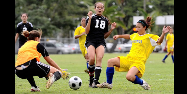 In BIIF girls soccer action the visiting St. Joseph Lady Cardinals ran into an overpowering Hilo High Viking team.