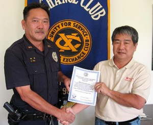 ishii_kenneth_large Aloha Exchange Club President Dale Tokuuke presents an 'Officer of the Month' award to Officer Kenneth Ishii
