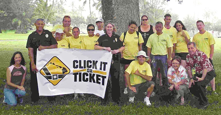 The Hawai'i Police Department's Traffic Services Section organized a sign waving event on Kamehameha Avenue in Hilo on Monday (May 24) to inform motorists that the annual "Click It or Ticket" Campaign for 2010 has started.

The Traffic Services Section was supported by members of the Office for Social Ministry, individual community members, Community Police Officer and members of the Impaired Driving Task Force at the sign waving event.