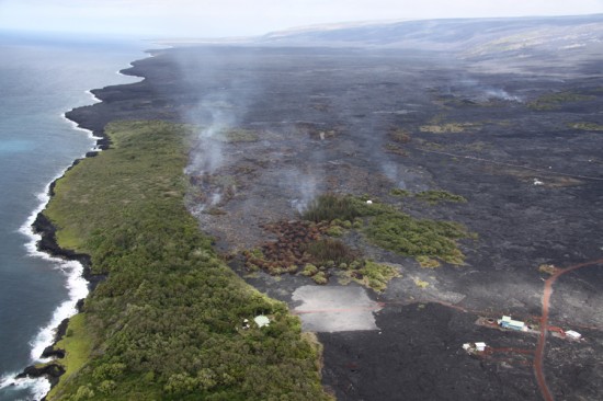 HVO News_06Jan2011_20100723_0531_torr In July 2010, lava burned vegetation on the coastal plain as active flows advanced toward Kalapana Gardens. Two homes in the subdivision were destroyed by lava during the past year.