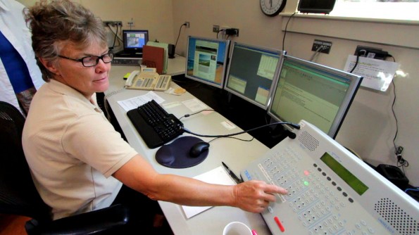 20110218_hvnp-veoc-dispatcher Hawaii Volcanoes National Park Dispatcher Annette Thornberry demonstrates the communications system used between the National Parks on the Big Island and in the Pacific like Guam.