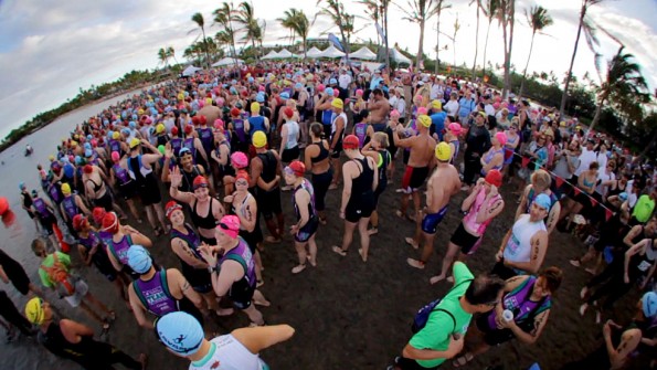 20110403_LavamanTriathlon-fisheye-startingline Swimmers get last minute instructions before the start of the 14th Annual Lavaman Triathlon at Anaehoomalu Bay in Waikoloa. Photography by Baron Sekiya | Hawaii 24/7