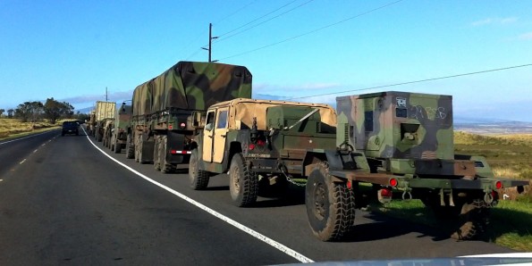 A military convoy pulls over onto the shoulder of Mamalahoa Highway (Hwy 190) to let traffic pass after exiting Saddle Road as it heads south to Waikolola Road. You probably would not want to get stuck behind this convoy on Saddle Road. Photography by Baron Sekiya | Hawaii 24/7