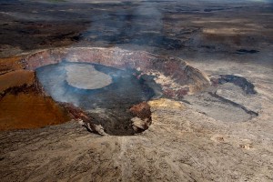 20110623_Puu-Oo-Lava-Lake-East View looking east into Pu‘u ‘O‘o, its crater partly filled by lava flows accumulating on the crater floor. The active lava lake in the crater is 205 m (673 ft) long and varies in width from 80-115 m (262-377 ft). The West Gap pit is in the central foreground, and the Puka Nui and MLK pits are to the right (the MLK pit is in back). The crater has filled in vertically about 100 m (328 ft) since the crater collapsed on March 5, 2011, at the start of the uprift Kamoamoa eruption. It still has about 12 m (39 ft) to go to reach the level of the crater floor prior to the collapse. Photo courtesy of USGS/HVO