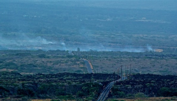 20110803_punaluu002 Smoke rises from a brushfire both mauka and makai of Highway 11 in Punaluu as seen looking North-East from Honuapo. Photography by Baron Sekiya | Hawaii 24/7