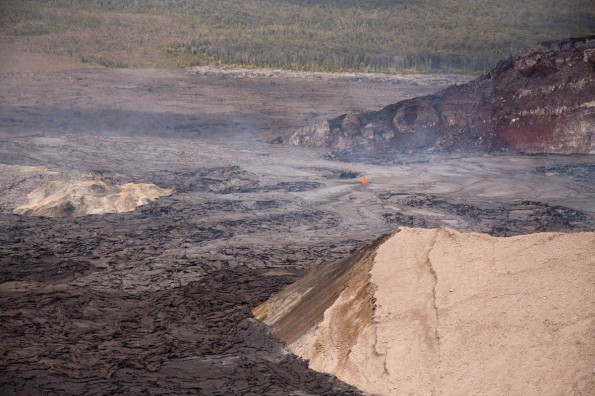 20110914_West-Lava-Lake A lava lake also fills the western side of the crater. This morning, lava overflowed that lake, and then filled and overtopped the northwest rim of a pit on the west side of the crater (the West Gap pit; just above and to the right side of the photo). These flows have traveled up to about 400 m down the northwest flank of Pu‘u ‘O‘o to its base. View is to the northwest.