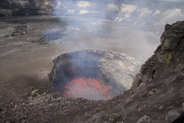Vigorously spattering on lake surface following wall-rock collapse Photo of the lava lake within the vent inset within the east wall and floor of Halema‘uma‘u Crater on March 3, 2011, just days before the Kamoamoa fissure eruption caused the lake level to drop much deeper and out of sight. Photo courtesy of USGS/HVO