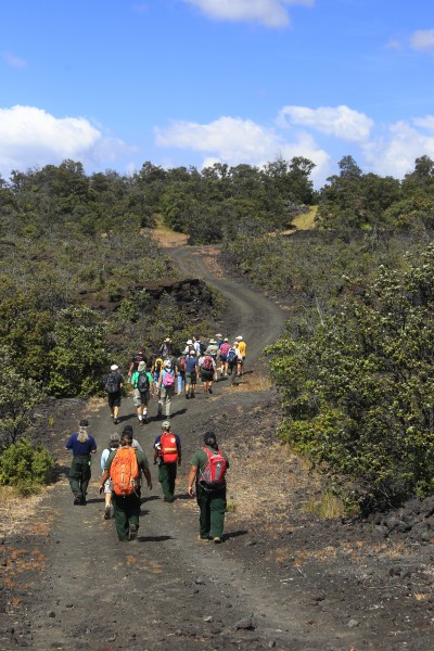 _P6D2855 by Dave Boyle Visitors walk through the Kahuku Unit of Hawaii Volcanoes National Parl. Photo courtesy of NPS/Dave Boyle