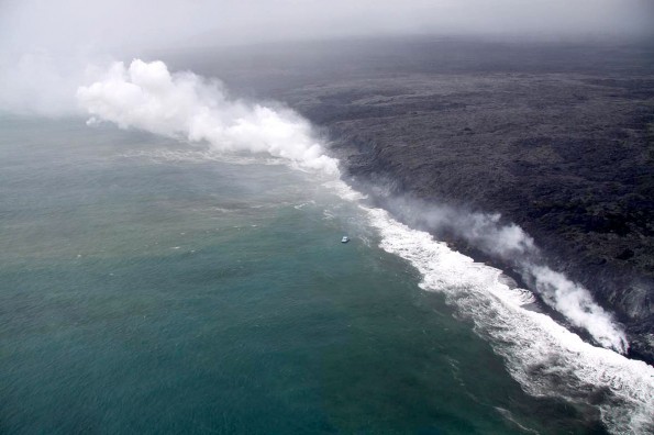 20111227_west-kailiili-shoreline Lava has continued to enter the ocean at West Kailiili, with numerous entry points scattered along a broad section of the coast. The small boat in the center of the image provides a rough sense of scale. Photo courtesy of USGS/HVO