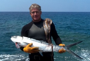 20120317_LS-Mark_Barville_Awa Mark Barville and the awa he caught that the white shark was trying to eat. Photo by Lynnette Stevens | Special to Hawaii 24/7