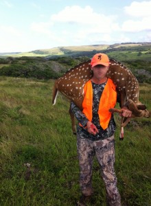 First axis deer reported taken on the Big Island in 2012. The hunter's face has been purposely blurred out. (Photo courtesy of DLNR)