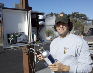 David_Benitez_HAVO_Ecologist Hawai‘i Volcanoes National Park Ecologist David Benitez checking the SO2 monitor at Steam Vents. Photo courtesy of HVNP