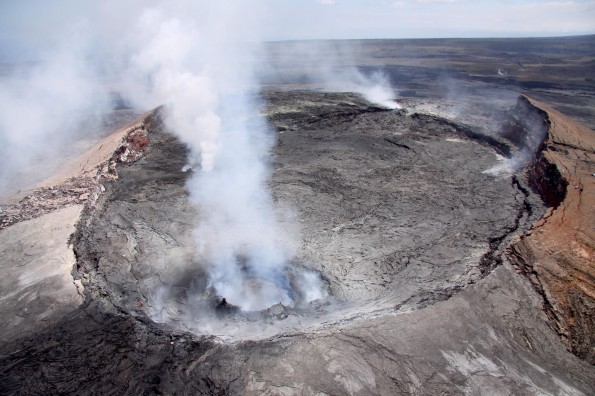 20120615_usgs-puuoo-SW View of Pu‘u ‘O‘o crater, looking Southwest Friday (June 15). In the foreground, an active, spattering lava pond is contained within a collapse pit near the east rim of the crater. Two additional vents, both emitting fume, can be seen behind the fume from the lava pond. Photo courtesy of USGS/HVO
