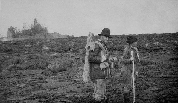 JA and I.P. Jaggar at source cones & fountains Mauna Loa flow Oct. 1919. Thomas Jaggar and his wife, Isabel, hiking on Mauna Loa during the September 1919 Southwest Rift Zone eruption. USGS archive photo.