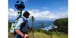 Rob Pacheco wears Google Trekker while overlooking Pololu Valley. (Photo courtesy of Hawaii Forest & Trail)