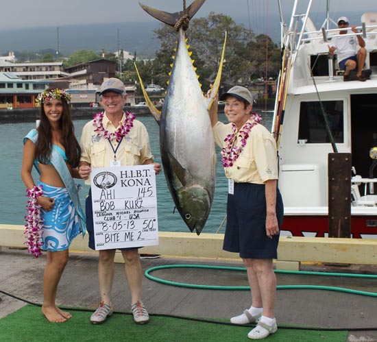 Veteran HIBT fisherman Bob Kurz and wife pose with Miss Billfish Cheynielle Pacheco and a yellowfin tuna. (Hawaii 24/7 photo by Karin Stanton)