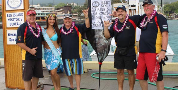 Game Fishing Club of Australia's Rolf Czabayski put the first marlin points on the board Monday during the first day of fishing. With him are teammates Ralph Czabayski, Steve Morris and Russell Bianco, and Miss Billfish Cheynielle Pacheco. (Hawaii 24/7 photo by Karin Stanton)