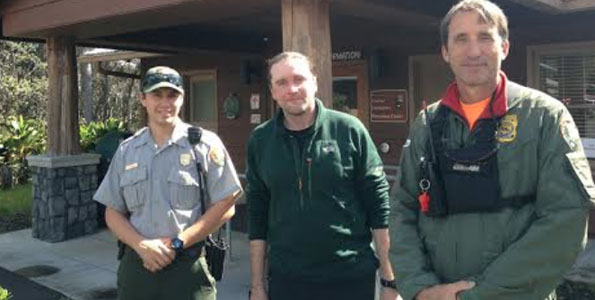 Rescued hiker Alex Sverdlov (middle) stands with his rescuers, park rangers John Broward (right) and Tyler Paul outside the park's Visitor Emergency Operations Center on Thursday. (Photo courtesy of J. Ferracane | NPS)