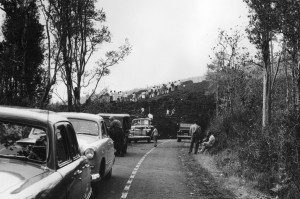 Spectators seeking a closer view of lava climbed up the levees of a thick ‘a‘ā flow that crossed Highway 11 during the June 1950 eruption of Mauna Loa. Stories of this and other lava flows in Ka‘ū and Kona will be recounted by USGS scientists in upcoming public talks. Photo: U.S. Army Air Corps.