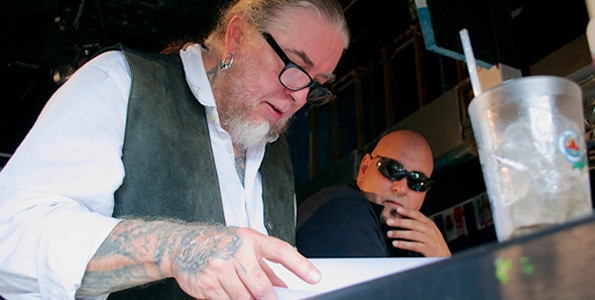 Richard Gonzalez, or Bullitt, looks on as Rockwood flips through a script. (Photo courtesy of GIFilms)