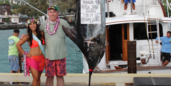 Miss Billfish Nicolette Noelani Palacol congratulates Angler Andrew Neill. (Hawaii 24/7 photo by Karin Stanton)