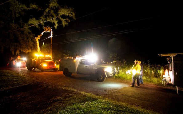 A Hawaiian Electric crew works late at night in Hawaiian Paradise Park restoring power to homes for residents. Photography by Baron Sekiya | Hawaii 24/7